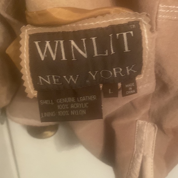 This is a leather and fur coat - Picture 6 of 6